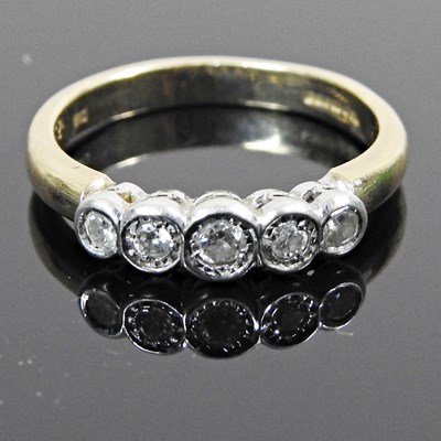 Lot 236 - A 9 carat gold five stone diamond ring,...