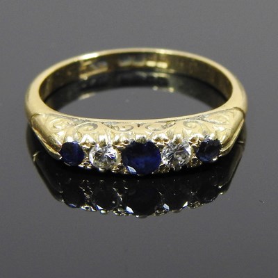 Lot 134 - An 18 carat gold sapphire and diamond ring,...