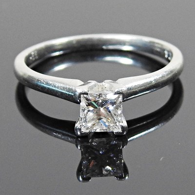 Lot 15 - A platinum and diamond solitaire ring, the...