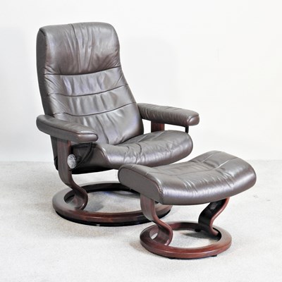 Lot 110 - A Scandinavian Ekornes brown leather swivel...