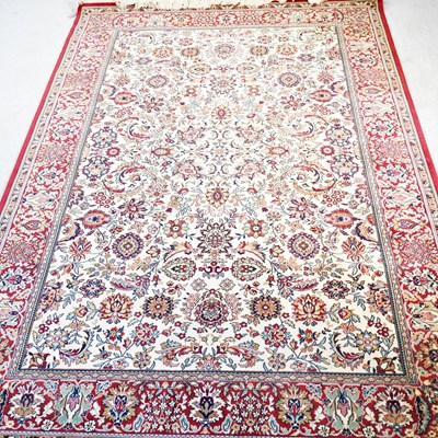 Lot 231 - A Persian Tabriz carpet, with floral and...