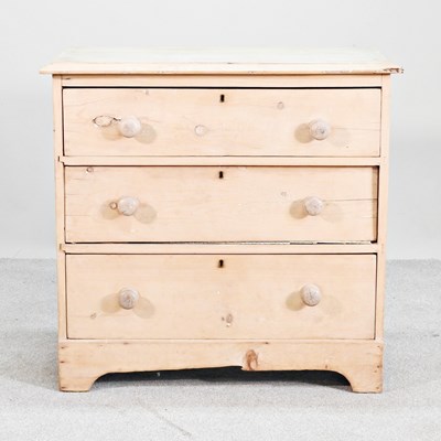 Lot 530 - An antique pine chest, of three long drawers