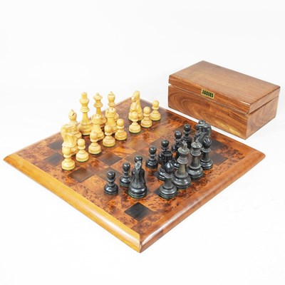 Lot 103 - A wooden chess set and board, 40 x 40cm