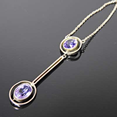 Lot 93 - An early 20th century amethyst set pendant...
