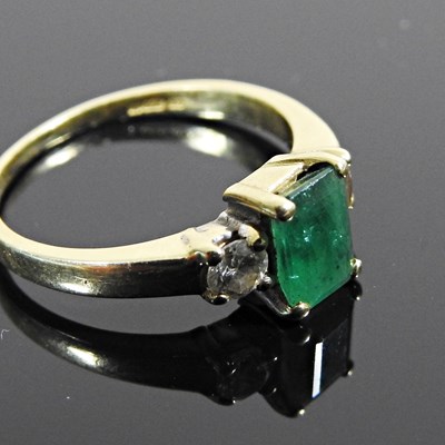 Lot 8 - An 18 carat gold emerald and diamond three...