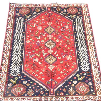 Lot 256 - A Persian qashgai rug, the central field...