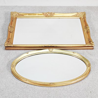 Lot 456 - A gilt framed wall mirror, of oval shape,...