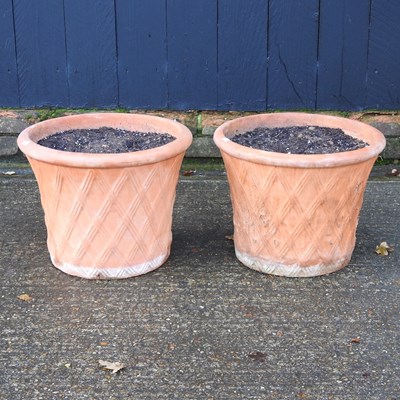 Lot 43 - A pair of terracotta garden pots, with lattice...