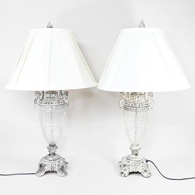 Lot 629 - A pair of ornate metal mounted glass table...