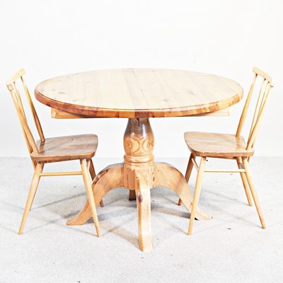 Lot 691 - A modern circular pine dining table, 105cm...