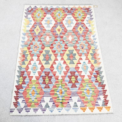 Lot 670 - A Persian kilim rug, with all over coloured...