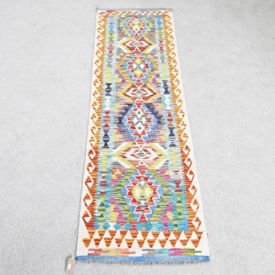 Lot 217 - A Persian kilim runner, with a row of...