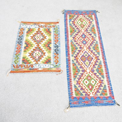 Lot 222 - A Persian kilim runner, with four central...