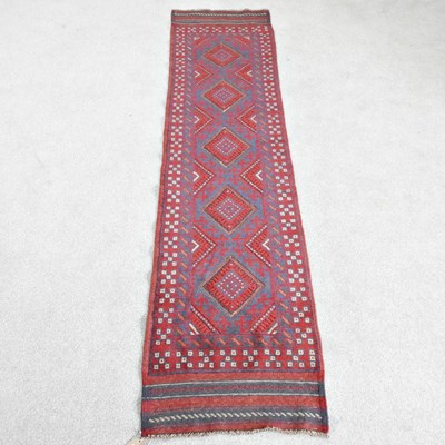 Lot 250 - A Persian runner, with a row of central...