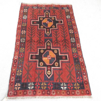 Lot 261 - A Baluchi rug, with two central medallions, on...