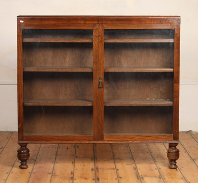 Lot 641 - A 1920s oak glazed bookcase