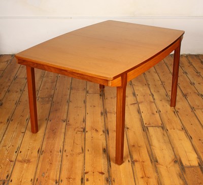 Lot 457 - A mid century teak extending dining table