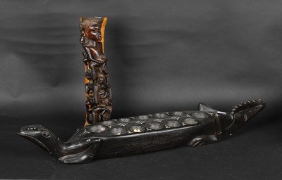 Lot 219 - A carved hardwood Mancala board, in the form...
