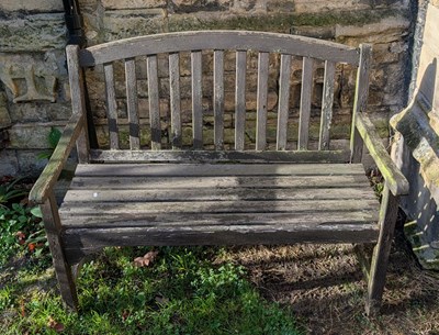 Lot 509 - A teak garden bench