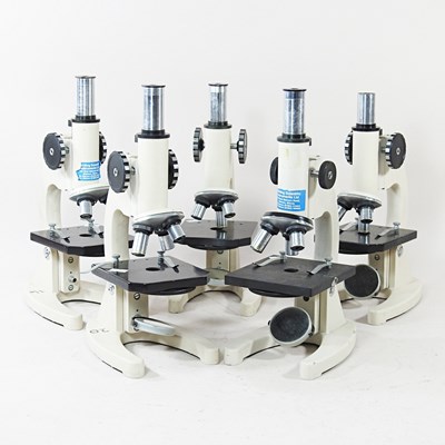 Lot 309 - A collection of five student's microscopes,...