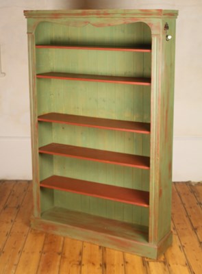 Lot 532 - A green painted pine open bookcase, w.128cm