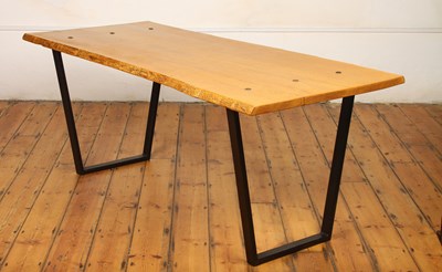 Lot 266 - A live edge oak dining table on black steel...