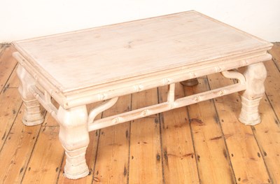 Lot 553 - A carved limed wood coffee table