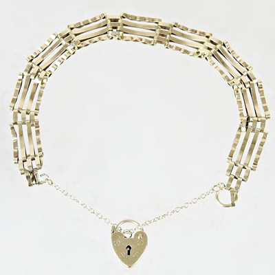 Lot 3 - A 9 carat gold gate bracelet, with a padlock...