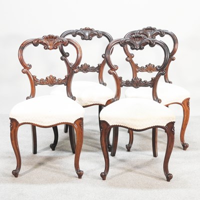 Lot 754 - A set of four Victorian carved walnut balloon...