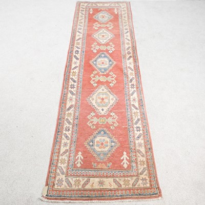 Lot 533 - A modern Persian runner, with a row of central...