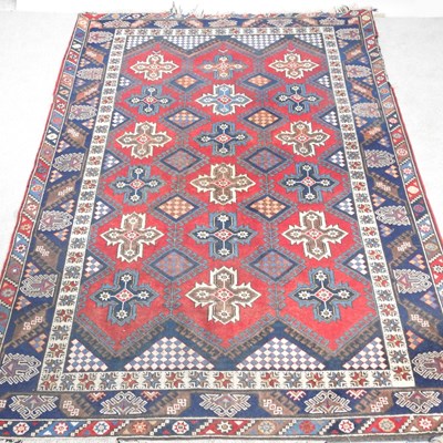 Lot 561 - An Afghan kazak rug, with all over medallions,...