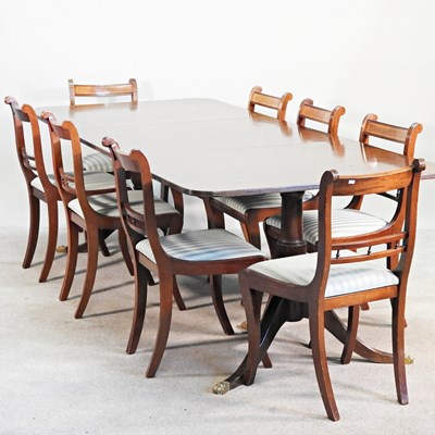 Lot 443 - A reproduction dining suite, comprising a...