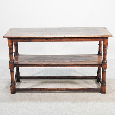Lot 592 - A 19th century oak side table, with a plank...
