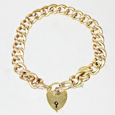 Lot 45 - A 9 carat gold curb link bracelet, with a...