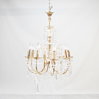 Lot 210 - An eight branch gilt chandelier, suspended...