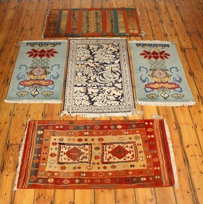 Lot 513 - A persian silk rug, decorated with flora and...