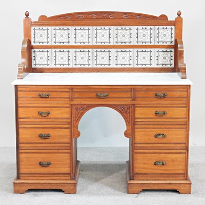 Lot 195 - An Edwardian walnut marble top washstand, with...