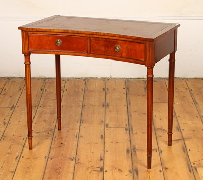 Lot 459 - An inverted bow fronted mahogany writing desk,...