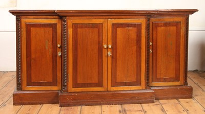 Lot 624 - A teak breakfront drinks cabinet, having a...