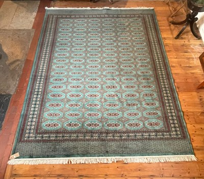 Lot 597 - A Bokhara rug, the medallions on a green ground