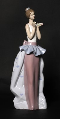 Lot 198 - A Lladro porcelain figure depicting a young...