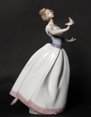 Lot 199 - A Lladro porcelain figure depicting a young...