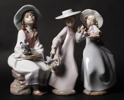 Lot 202 - A Lladro porcelain figure depicting two girls...