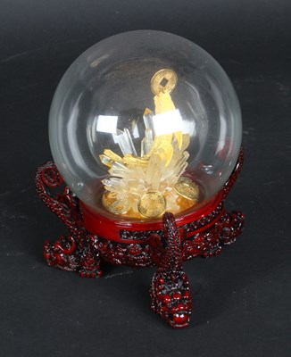 Lot 733 - A Singapore fish of abundance, in glass orb in...