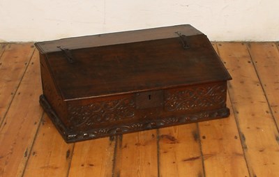 Lot 474 - A 17th century carved oak bible box, having an...
