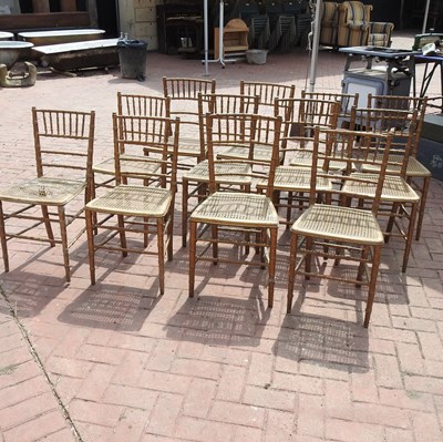 Lot 91 - A set of twelve gilt painted dining chairs