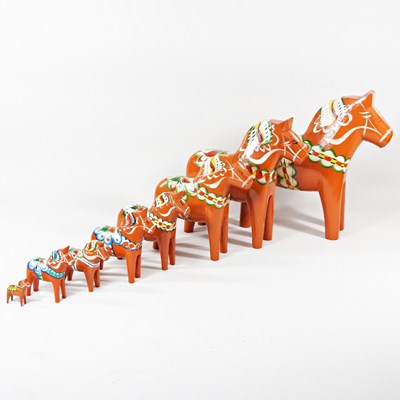 Lot 418 - A set of eight Swedish painted wooden Dala...