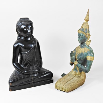 Lot 221 - An Asian carved ebony figure of Buddha, shown...