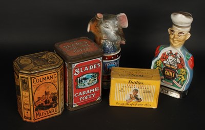 Lot 709 - A collection of tins and ceramic jars...