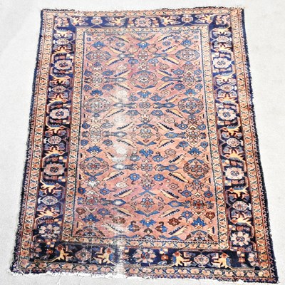 Lot 503 - A Turkish rug, with foliate designs, within a...